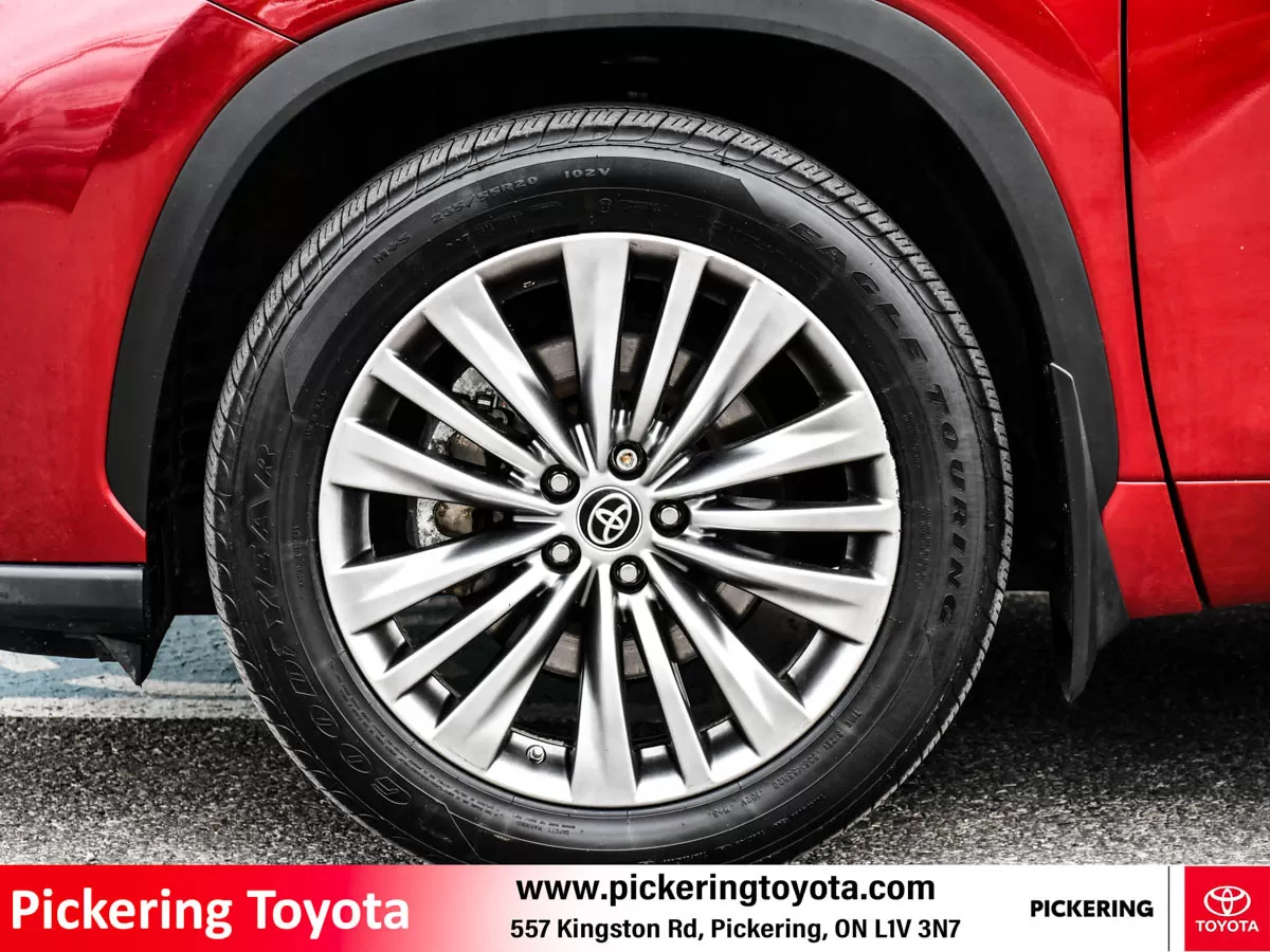 Close-up view alloy wheel and tire Goodyear Eagle Touring of a red 2022 Toyota Highlander Hybrid Limited AWD SUV at Pickering Toyota dealership